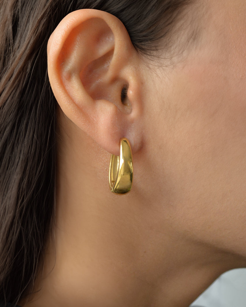 Lana bold hoop earrings worn on ear – everyday waterproof gold hoops