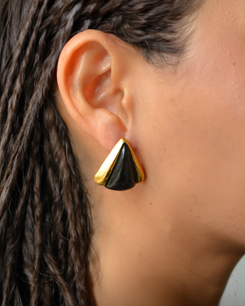 Lume black onyx triangle studs worn on ear – bold waterproof design for daily wear