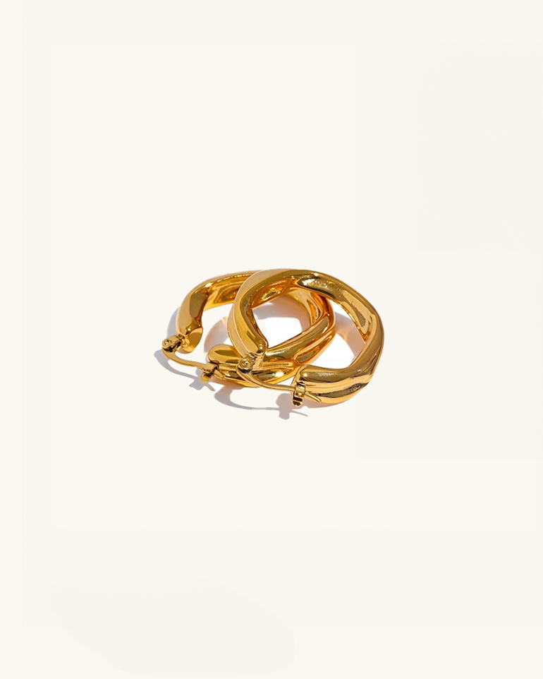 Set of Luz twisted hoop earrings stacked – gold waterproof finish