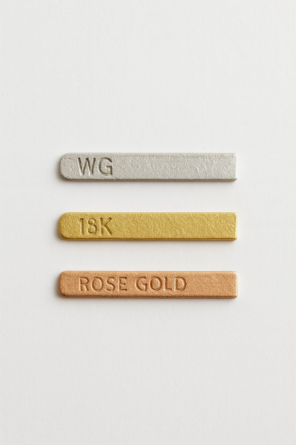 Visual comparison of white gold, yellow gold, and rose gold metals for jewellery selection