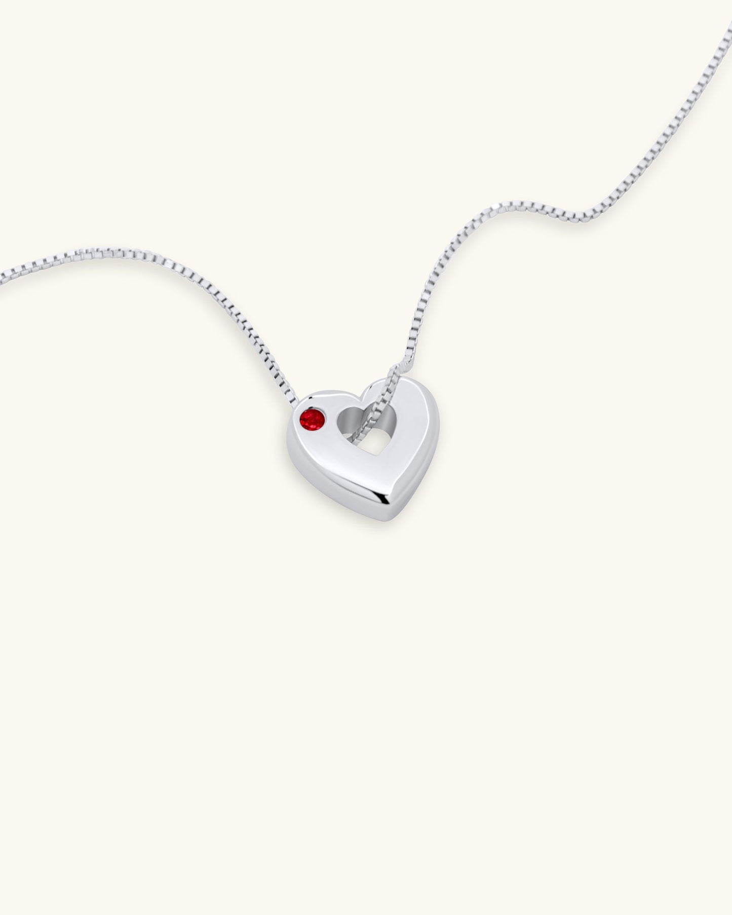 Close-up of July Ruby Heart Pendant Necklace – White Gold Vermeil