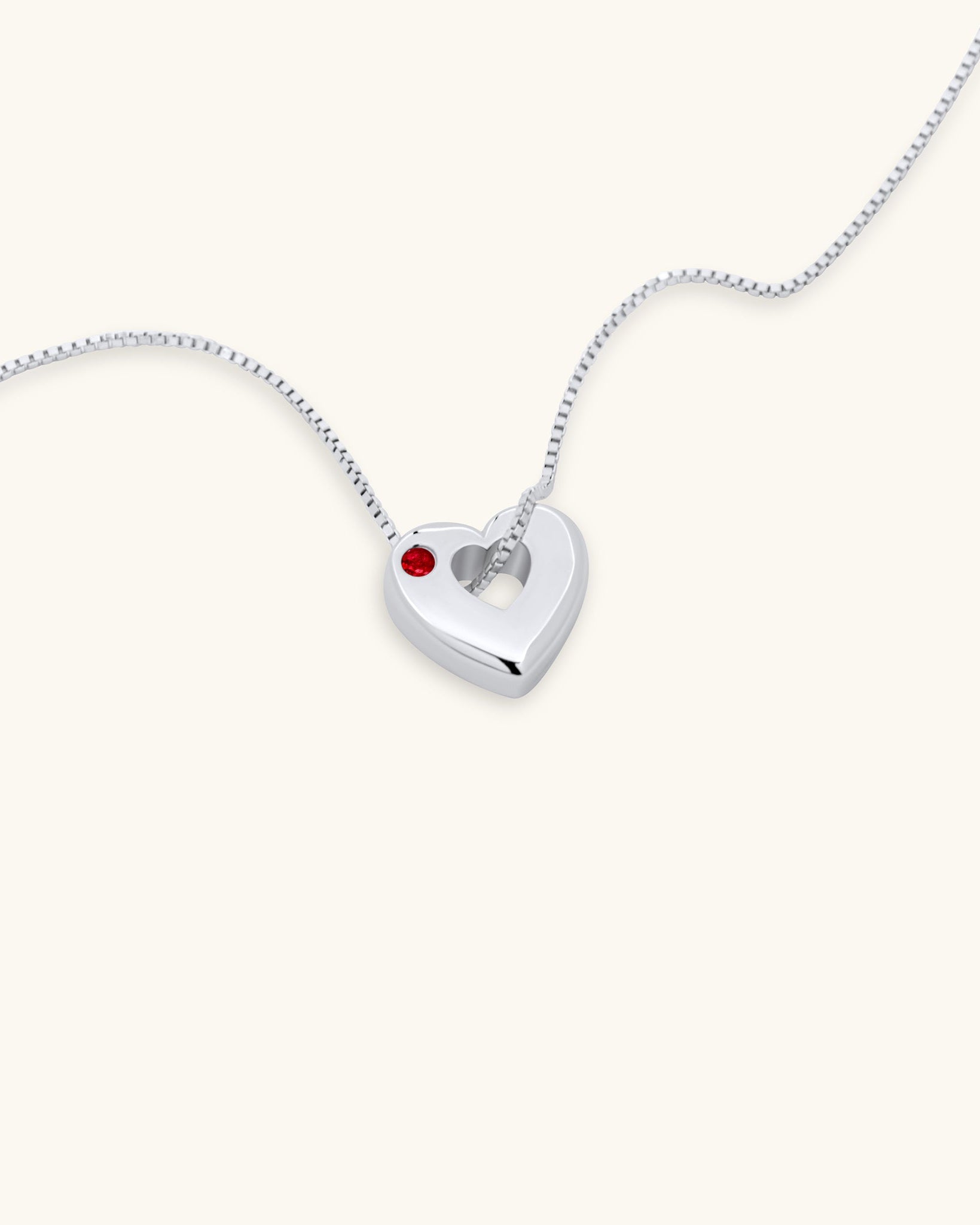 Close-up of July Ruby Heart Pendant Necklace – White Gold Vermeil